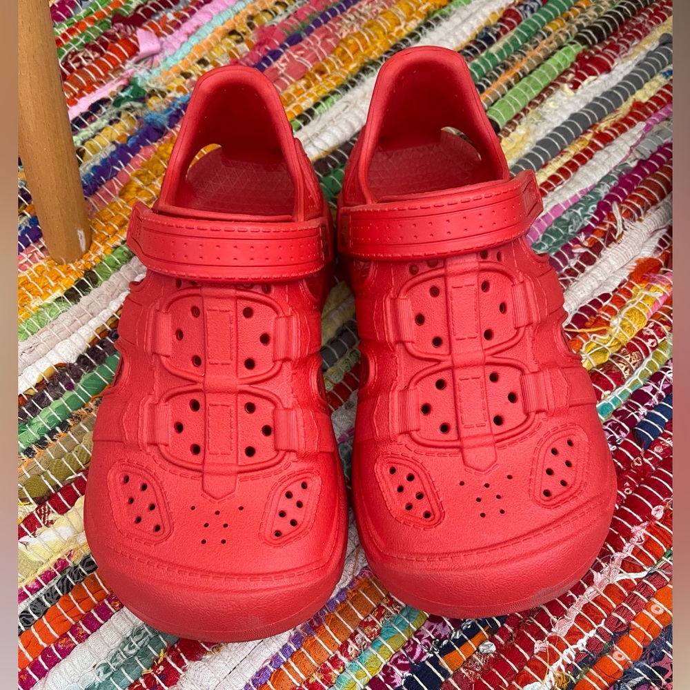 Teva rubber shoes.